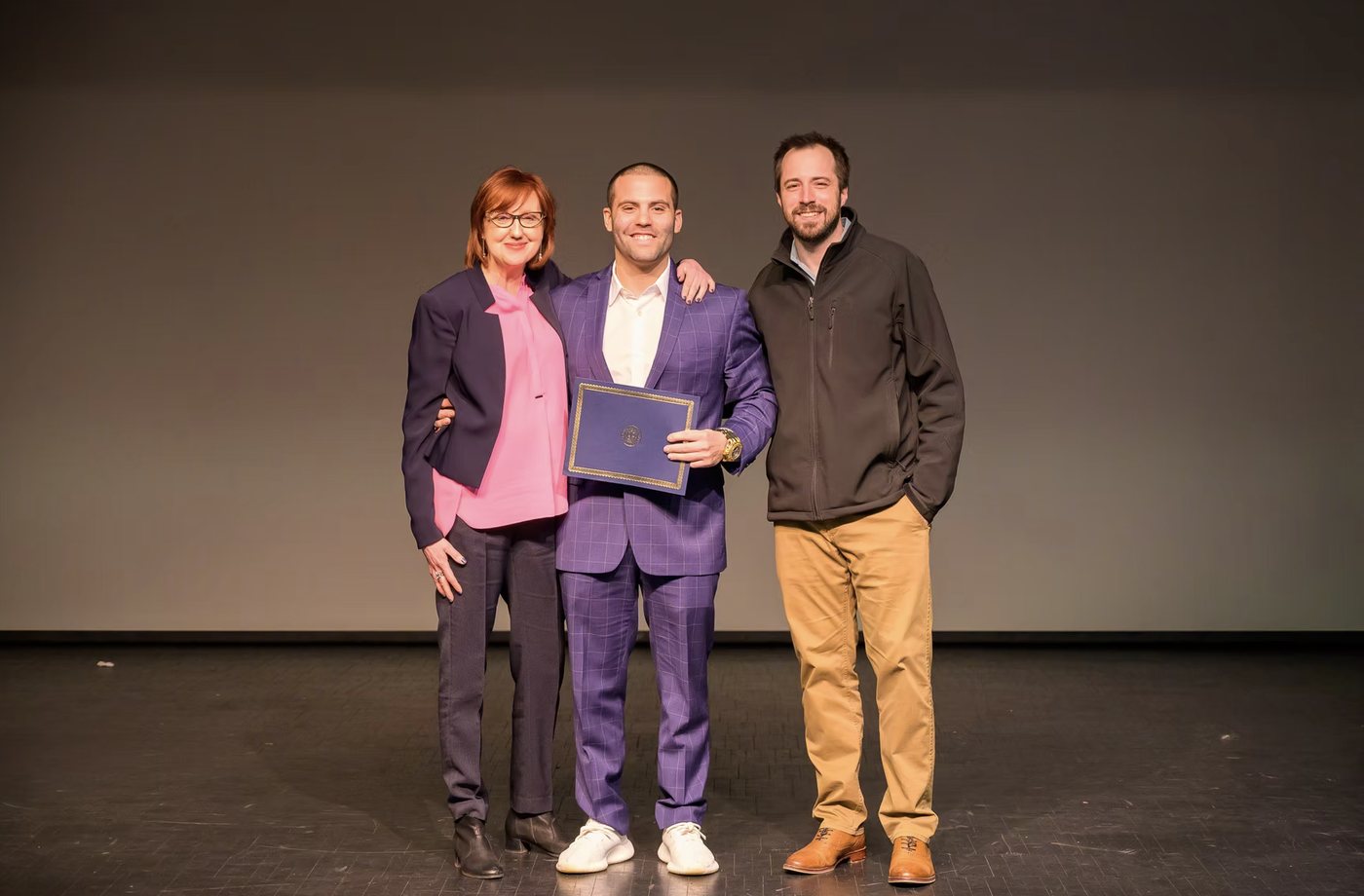 Frank Mellana on stage receiving the 2nd place award at the 2019 Kean University Business Plan Competition