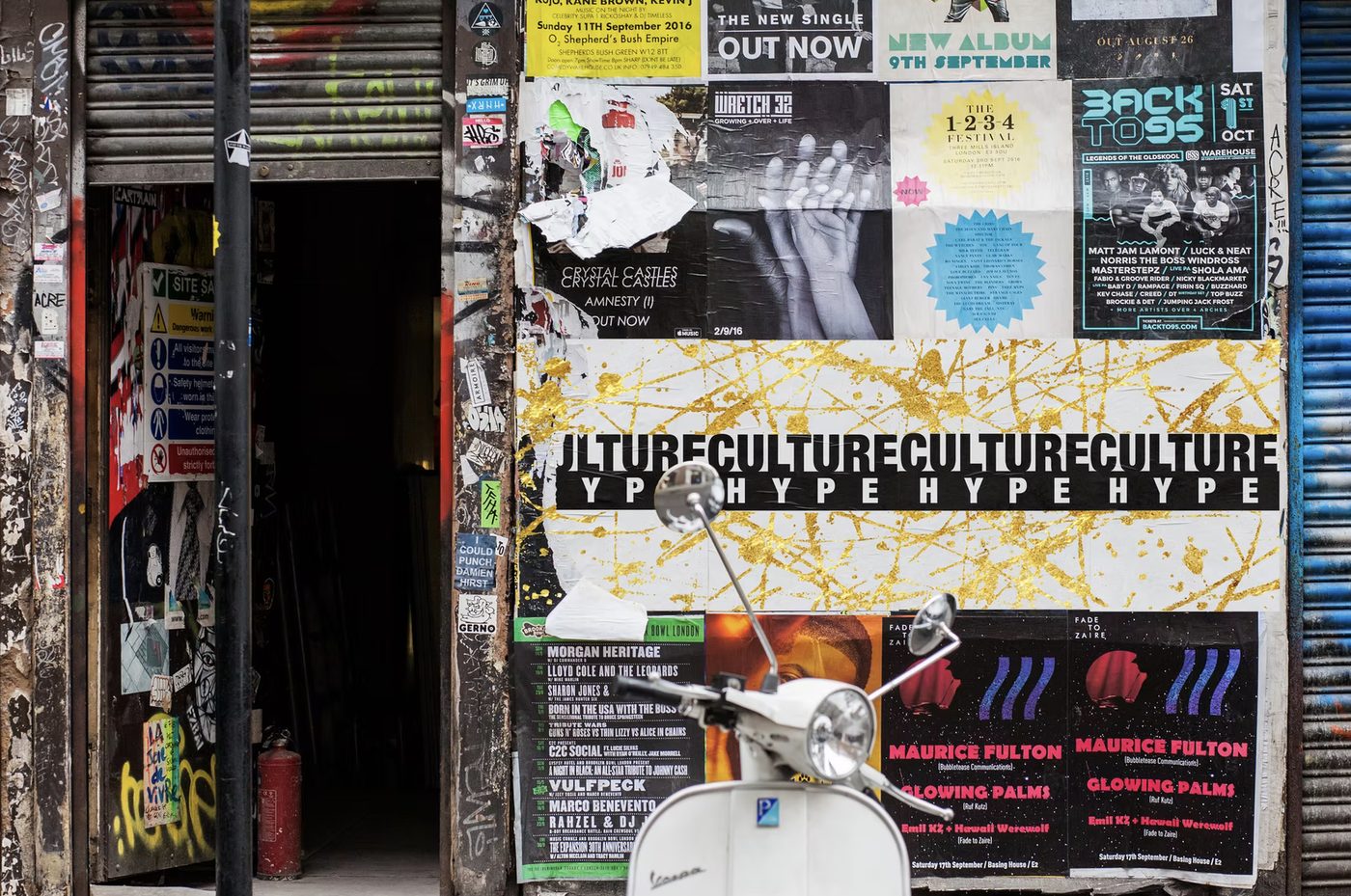 Culture Hype posters pasted on a city wall