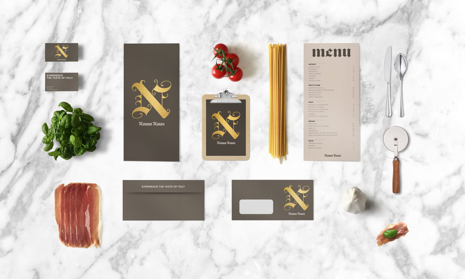 Nonno Nino's menu and stationery flatlay on marble