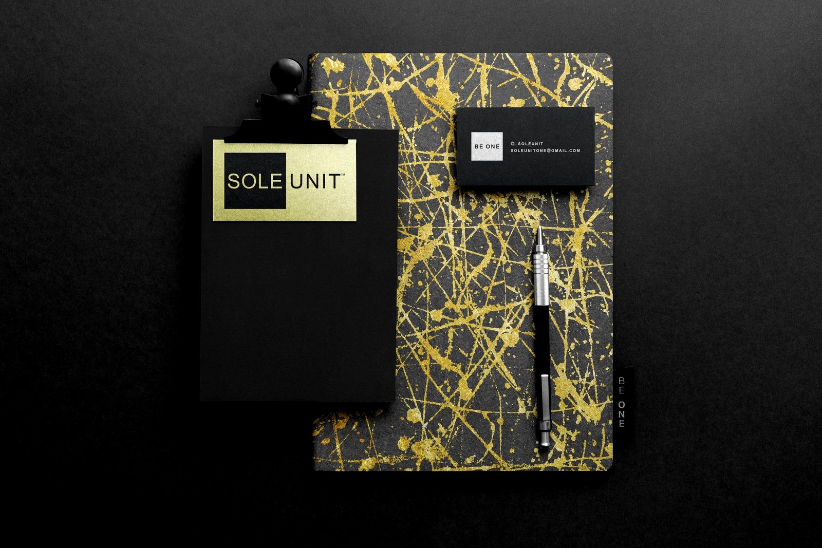 Sole Unit stationery: gold splatter notebook, clipboard, and card set